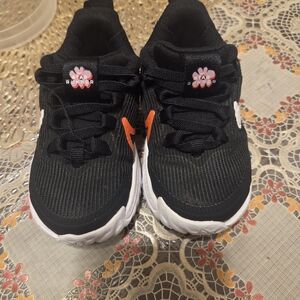 Nike Kids Black and White Sneakers with Orange Accents